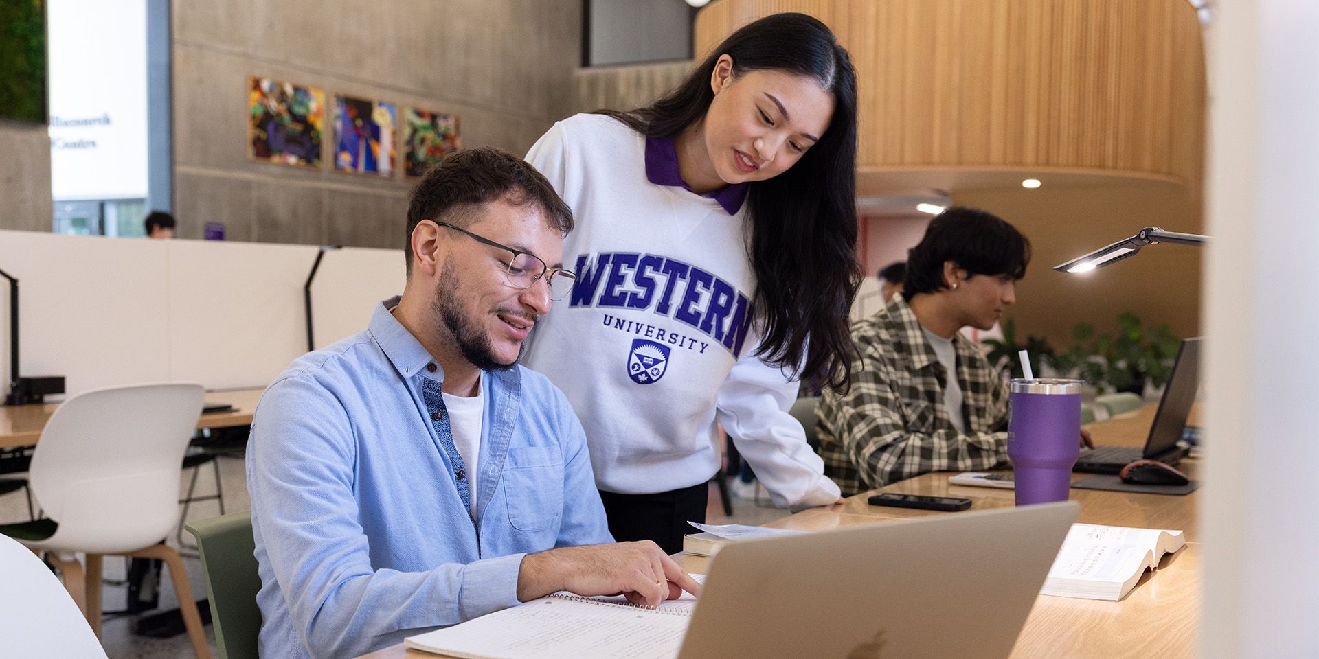 Student and tutor in the library.